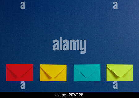 Colorful envelopes on blue background Stock Photo