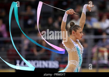 Sofia, Bulgaria - 14 September, 2018: Aleksandra SOLDATOVA froom Russia performs with ribbon during The 2018 Rhythmic Gymnastics World Championships.  Stock Photo