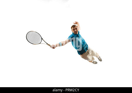 The one caucasian man playing tennis isolated on white background. Studio shot of fit young player at studio in motion or movement during sport game.. Stock Photo