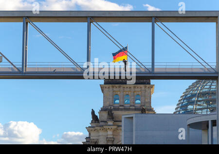 man on bridge with modern buildings Stock Photo