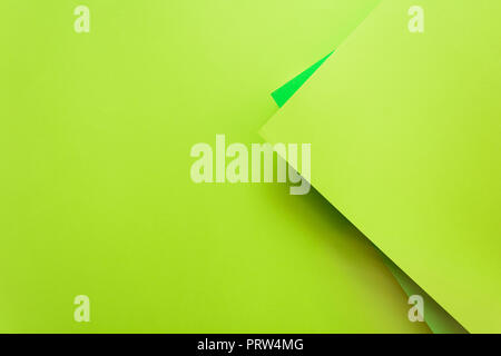 Green and lime pastel color papered background. Volume geometric flat lay. Top view. Copy space Stock Photo