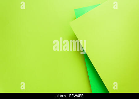 Green and lime pastel color papered background. Volume geometric flat lay. Top view. Copy space Stock Photo