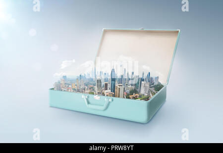 Modern city skyline in an open retro vintage suitcase isolated on light blue background . Stock Photo