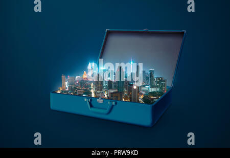 Night scene modern city in an open retro vintage suitcase isolated on blue background . Stock Photo