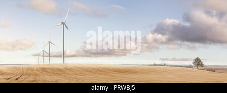 Wind turbines on a vast field panorama Stock Photo
