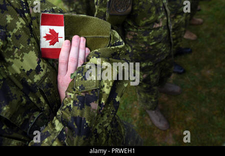 Canada patch flag on soldiers arm. Canadian troops Stock Photo
