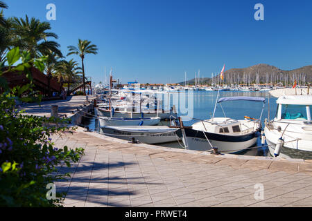 ALCUDIA, MAJORCA, SPAIN - September 23rd, 2018: Promanade along marina.  Port d'Alcudia  is a popular resort town and holiday destination on the north Stock Photo