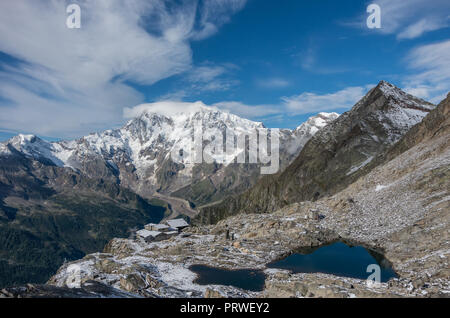 Smeraldo lake and funicular station with Rosa Mount on the background. View from Monte Moro pass near Macugnaga, Italy Stock Photo