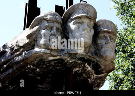 Heroic communist faces outside the Transnistrian Railway Station in Bender called Bender-1 in Moldova Stock Photo