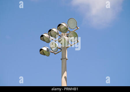 Stadium lights, unlit, against blue sky. Cabaniss football field in Corpus Christi, Texas USA. Stock Photo