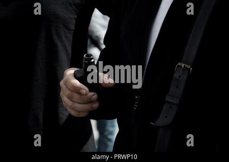 October 4, 2018 - Athens, Greece - A protester seen holding a vapor cigarette during the protest..People protest outside the Ministry of Health, against the circular of Ministry of Health that bans the sale of vapor cigarettes (Credit Image: © Giorgos Zachos/SOPA Images via ZUMA Wire) Stock Photo