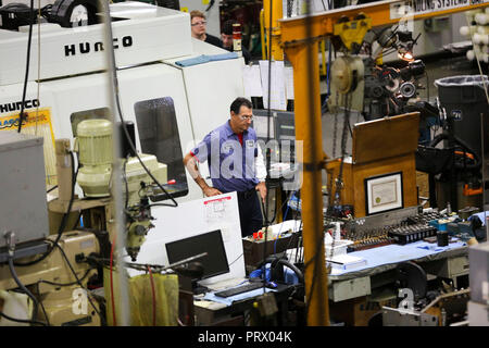 Beijing, USA. 22nd Aug, 2018. Staff members work at the workshop of ...