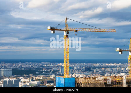 crane at construction site of skyscraper in Moscow city in autumn day Stock Photo