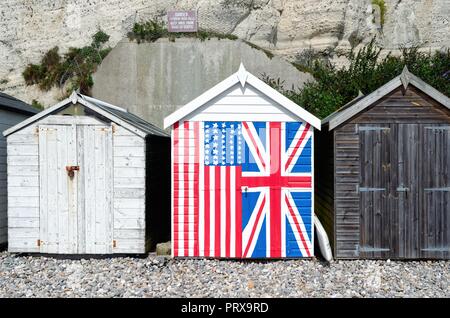 Beach hut hand painted in the flags of the United Kingdom and United states of America, Beer East Devon England UK Stock Photo