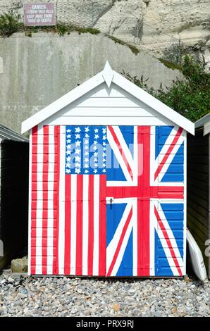 Beach hut hand painted in the flags of the United Kingdom and United states of America, Beer East Devon England UK Stock Photo