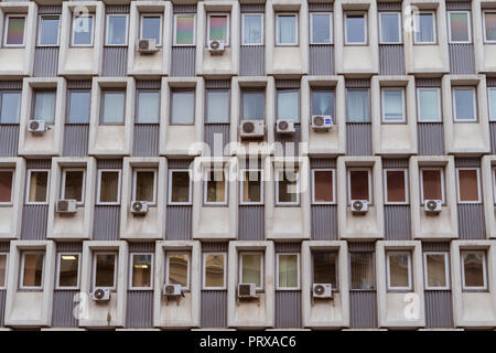 Air conditioners mounted on a wall of a soviet era office building in Moscow, Russia Stock Photo