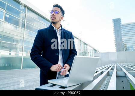 Thoughtful businessman looking away Stock Photo