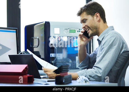 Engineer talking on smart phone Stock Photo