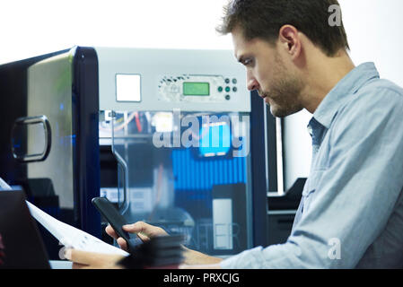 Engineer using smart phone Stock Photo