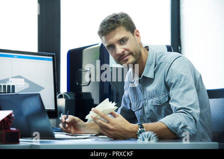 Engineer working in office Stock Photo