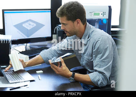 Engineer using laptop in office Stock Photo