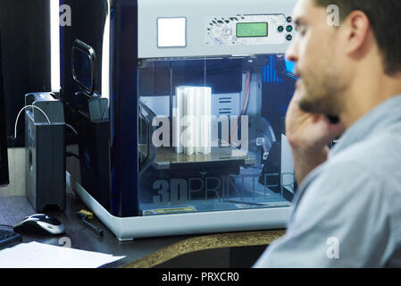 Engineer talking on smart phone Stock Photo