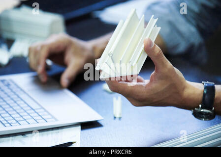 Engineer using laptop in office Stock Photo