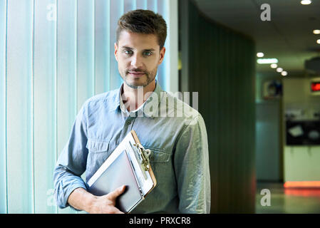 Portrait of engineer standing in office Stock Photo