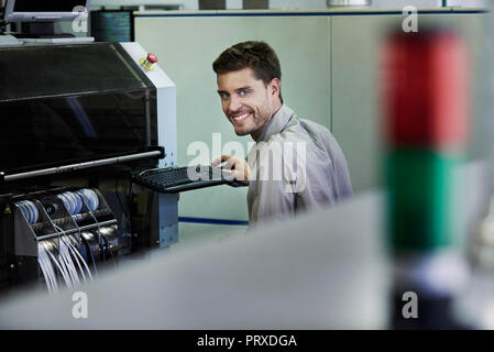 Portrait of engineer sitting in office Stock Photo