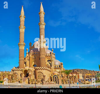 Panorama of Al Sahaba (Al Mustafa) mosque, designed in Ottoman style and neighboring with quarters of local bazaar, Sharm El Sheikh, Egypt. Stock Photo