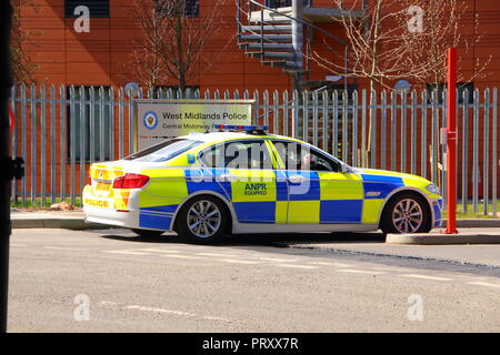 A police BMW patrol car at the entrance gates to Perry Barr Police Station. Stock Photo