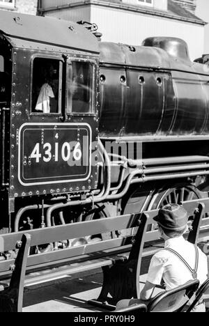 steam engine driver sitting in cab on footplate of steam train Stock ...