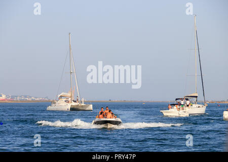 Huelva, Spain - July 16, 2017: Unidentified people enjoy activities on motor boat in Huelva bay Stock Photo