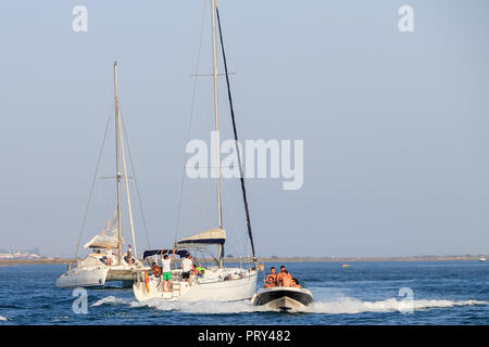 Huelva, Spain - July 16, 2017: Unidentified people enjoy activities on motor boat in Huelva bay Stock Photo