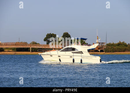 Huelva, Spain - July 16, 2017: Unidentified people enjoy activities on motor boat Punta Umbria beach Stock Photo