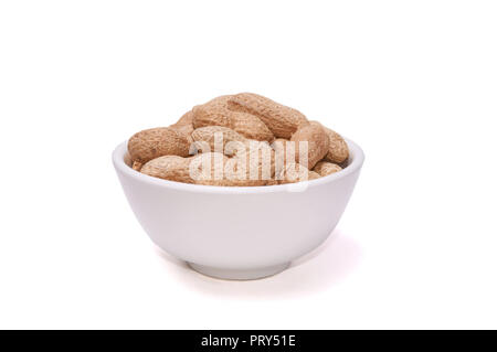 Peanuts in a white cup on a white background Stock Photo