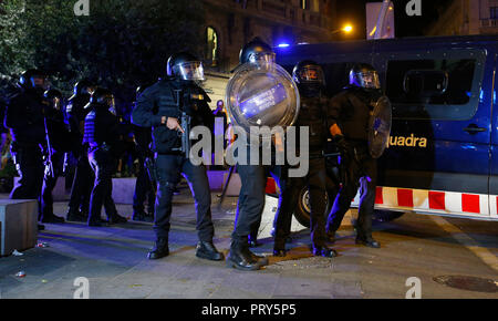 Catalan Mosos police clashes against the demonstrators during the first anniversary of the Spanish banned independence referendum in Catalonia. Stock Photo