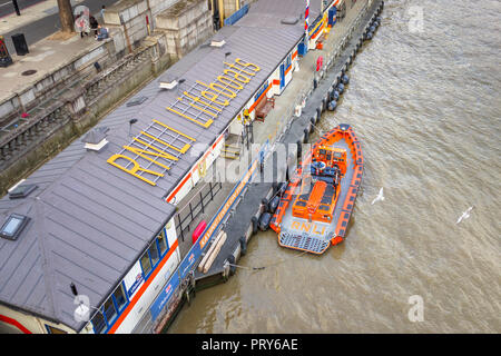 E Class lifeboat 'Hurley Burley', River Thames RNLI lifeboat pier Tower Lifeboat Station, Victoria Embankment by Waterloo Bridge, Westminster, London Stock Photo