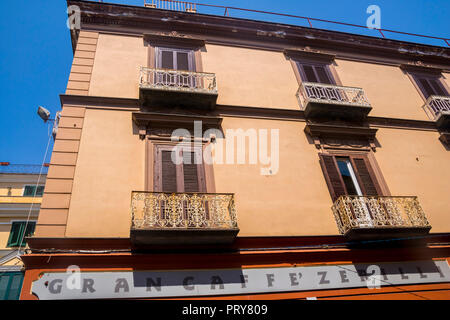 Italian buildings, wooden shutters, balcony, balconies, verandah, old fashioned building, vintage concept, travel tourism, holiday, ornate iron italy Stock Photo