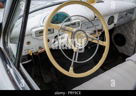 RUSSIA, TAGANROG, 09 MAY 2018: View of the white dashboard of car and steering wheel of a GAZ-21 Volga car Stock Photo