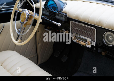 RUSSIA, TAGANROG, 09 MAY 2018: White dashboard of the car GAZ-21 Volga. View from the passenger door Stock Photo