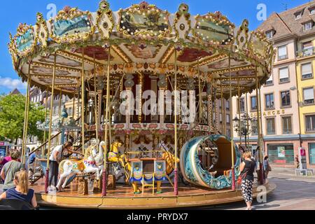 Old fashioned Merry go round at Place Gutenberg in Strasbourg, France Stock Photo