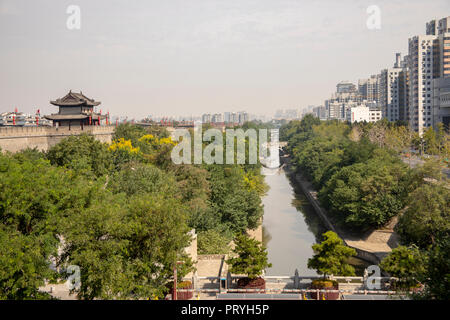 Ancient moat around reconstructed city wall seperating old and modern Xi'an, Shaanxi Providence, China. Stock Photo