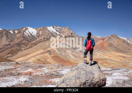 Tourist on the 4,655 meter Ak-Baital Pass on the remote Pamir Highway, Gorno-Badakhshan Autonomous Region, Tajikistan. Stock Photo