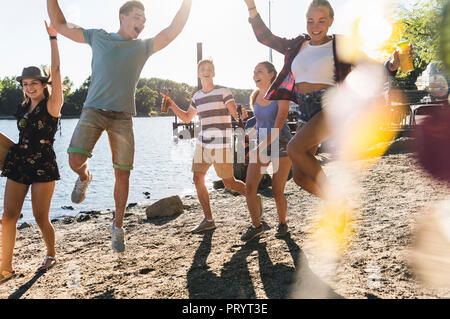 Group of happy friends having fun at the riverside Stock Photo