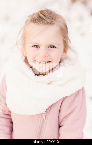 Portrait of happy little girl in winter Stock Photo