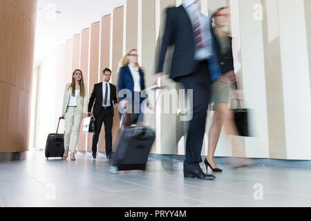 Poland, Warzawa, group of businessmen arriving at hotel Stock Photo