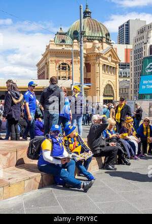 West Coast Eagles fans gathering at Federation Square prior to marching together to the 2018 AFL Grand Final. Stock Photo