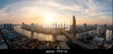 Landscape of Chao phraya river in Bangkok city in evening time with bird view. Bangkok City at night time, Hotel and resident area in the capital of T Stock Photo