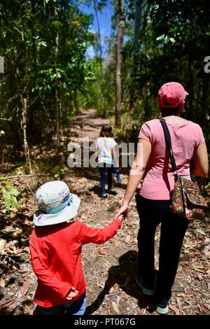 Mother and daughters walk along the Dalrymple gap walking track, QLD, Australia Stock Photo